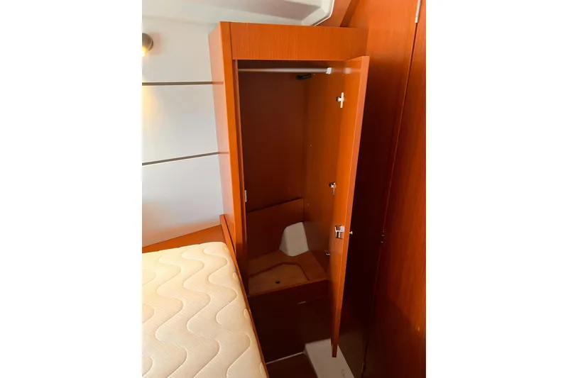 Slide: The Image of Beneteau Oceanis 38.1 sailboat deck with ropes and wooden handrail, 2017 model. - 15