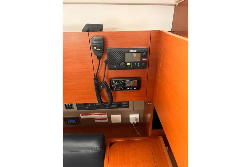 Slide: The Image of Control panel of 2017 Beneteau Oceanis 38.1 yacht with communication equipment. - 23