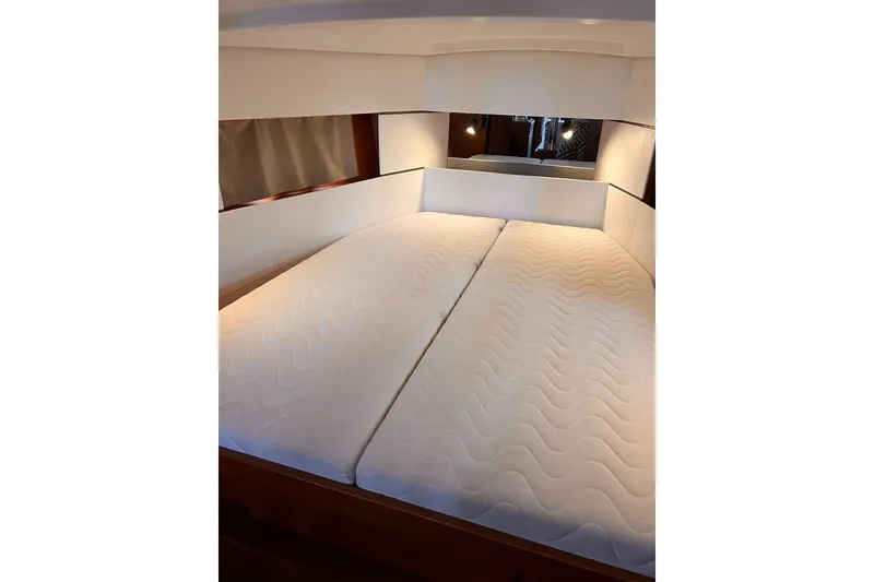 Slide: The Image of Interior cabin of 2017 Beneteau Oceanis 38.1 yacht with comfortable bedding. - 28
