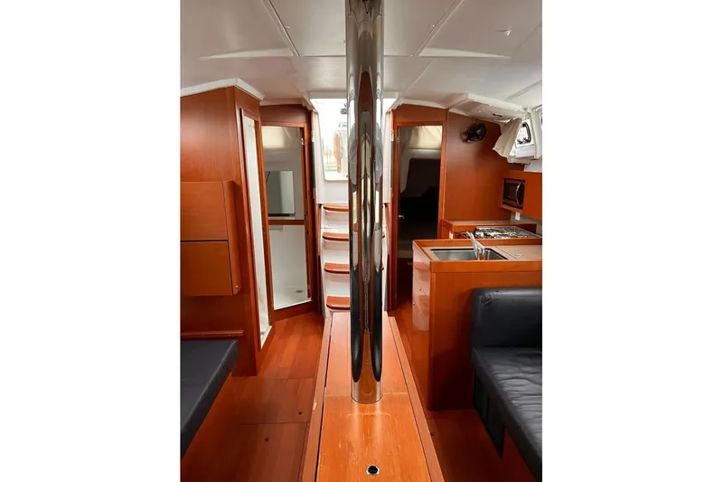 Slide: The Image of Interior of 2017 Beneteau Oceanis 38.1 yacht with wood finish and modern amenities. - 34