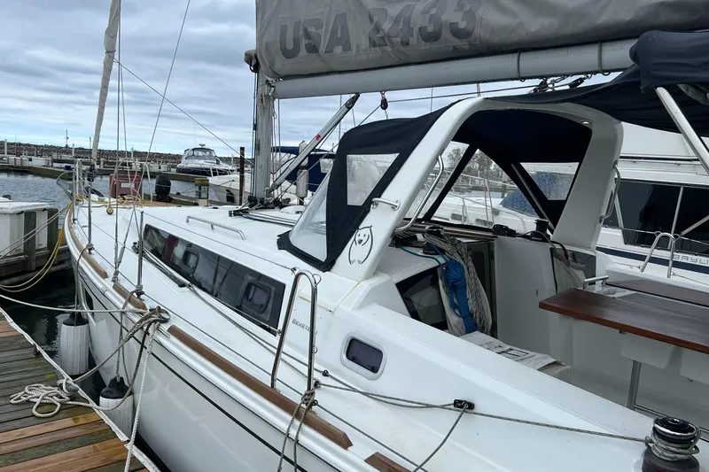 Slide: The Image of 2017 Beneteau Oceanis 38.1 sailboat docked at marina, featuring sleek design and spacious cockpit. - 5