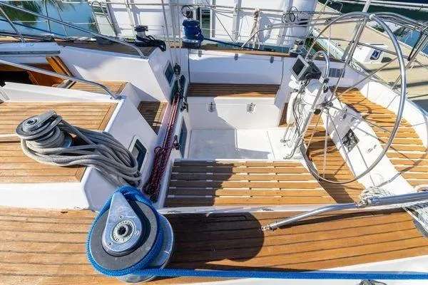 Slide: The Image of Cockpit of 1989 Wauquiez Centurion 47 sailboat with wooden deck and steering wheel. - 6