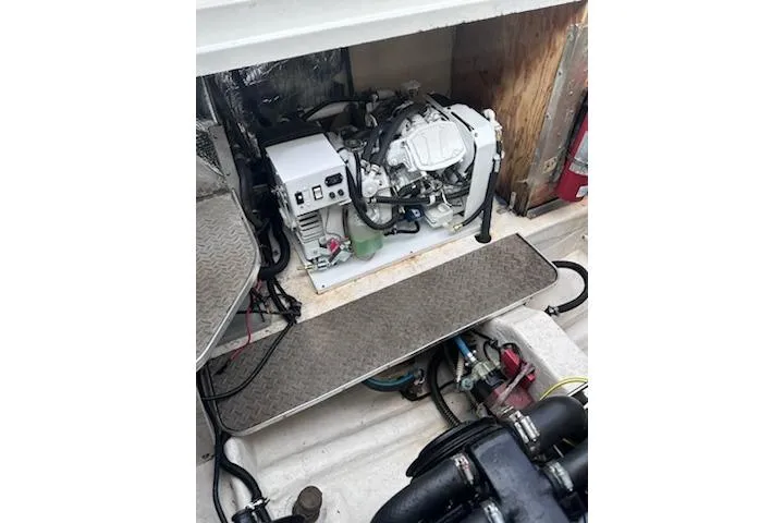 Slide: The Image of Engine compartment of a 1995 Formula 31 Performance Cruiser, showcasing mechanical components. - 13