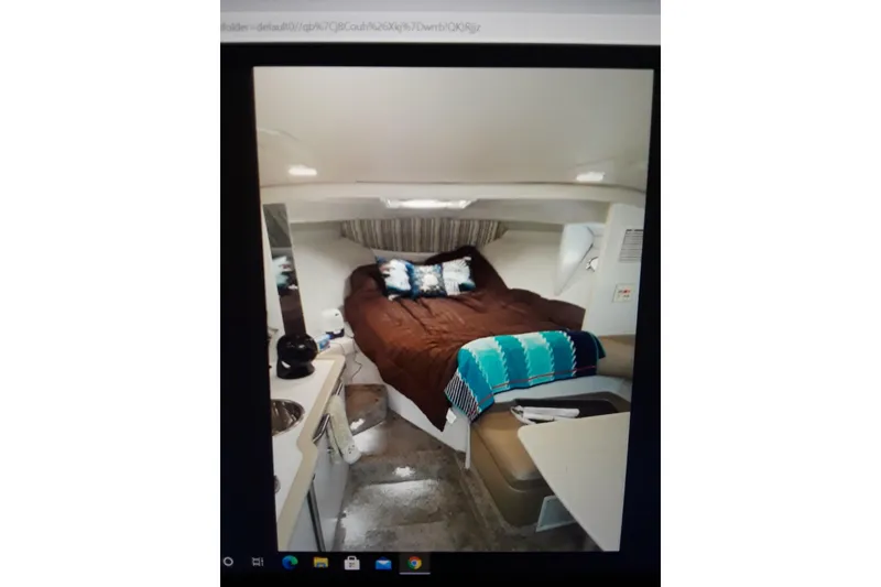 Slide: The Image of Interior of 1995 Formula 31 Performance Cruiser with cozy bed and seating area. - 7