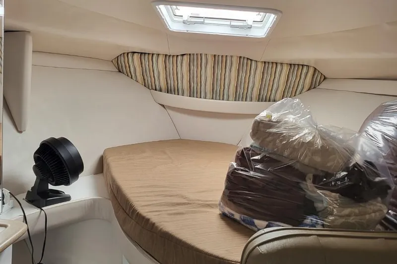Slide: The Image of Cozy cabin interior of 1995 Formula 31 Performance Cruiser with bed and fan. - 8