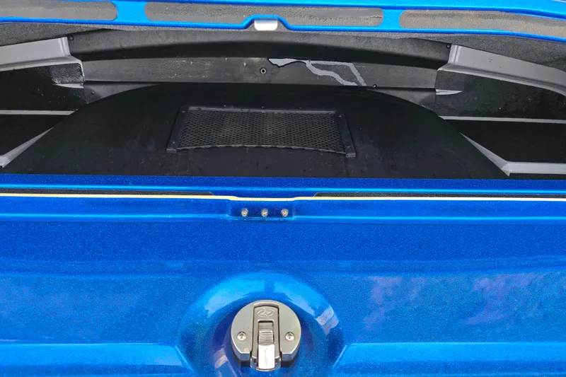 Slide: The Image of Blue 2023 Supra SL 450 boat storage compartment with secure latch. - 10