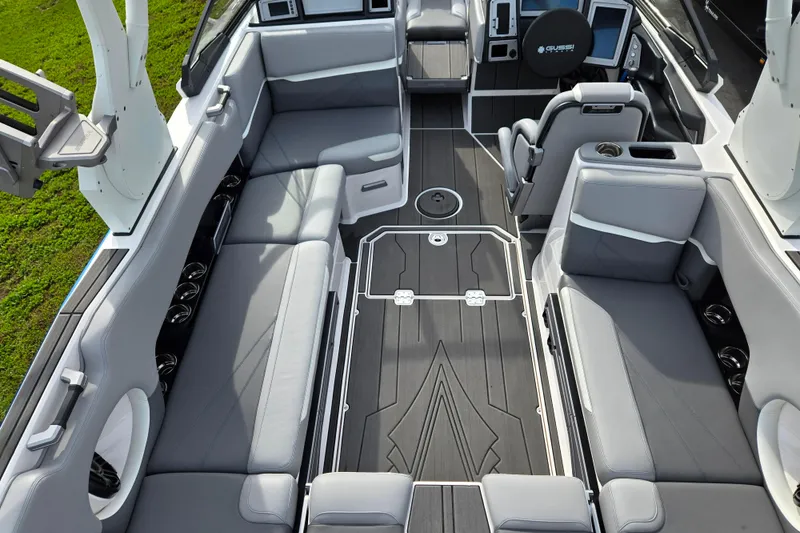 Slide: The Image of 2023 Supra SL 450 boat interior with sleek gray seating and modern design. - 11