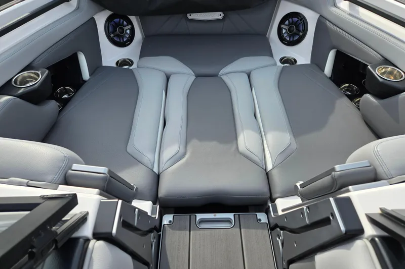 Slide: The Image of 2023 Supra SL 450 interior with luxurious seating and integrated speakers. - 13