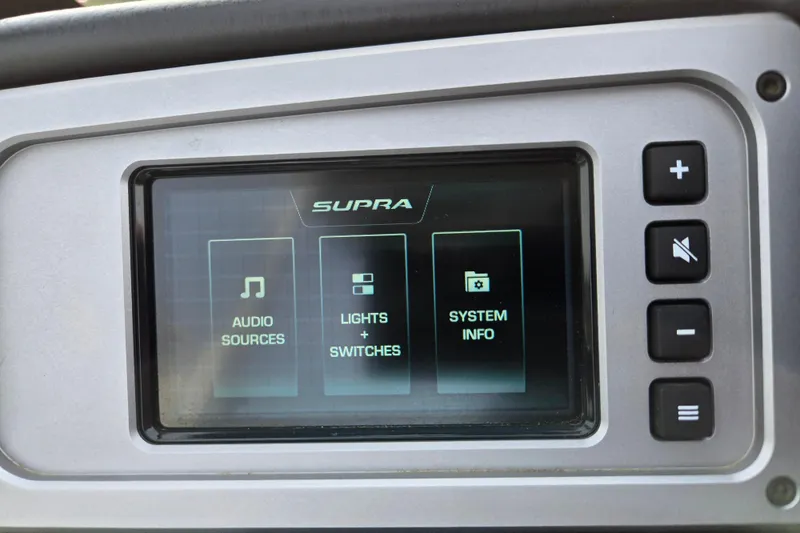 Slide: The Image of 2023 Supra SL 450 dashboard display with audio, lights, and system info options. - 15