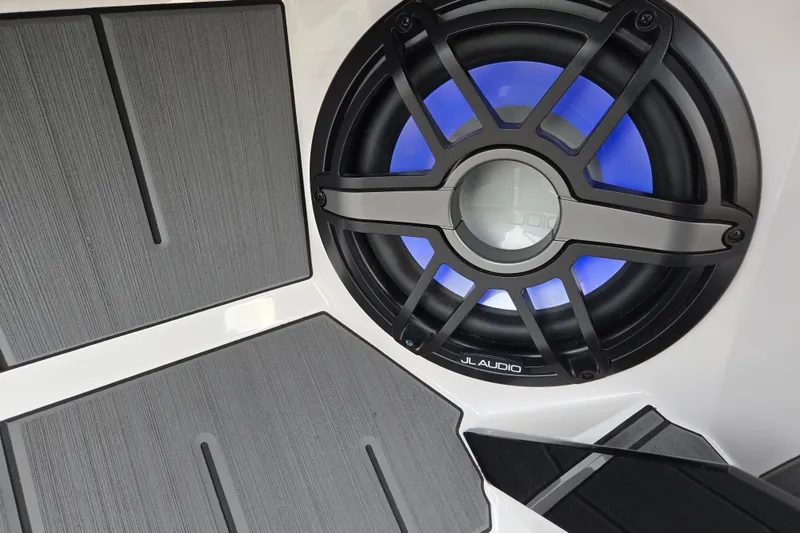 Slide: The Image of 2023 Supra SL 450 with JL Audio speaker and blue LED lighting. - 17