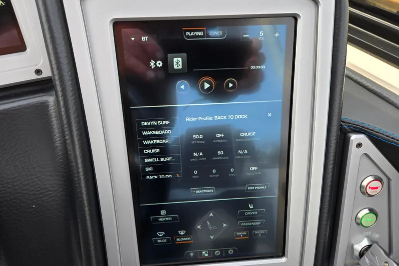 Slide: The Image of Touchscreen control panel in a 2023 Supra SL 450 boat, displaying various settings and profiles. - 20