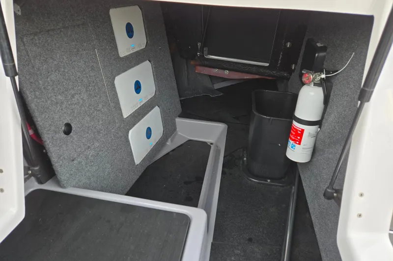 Slide: The Image of 2023 Supra SL 450 interior storage with fire extinguisher and equipment compartments. - 26