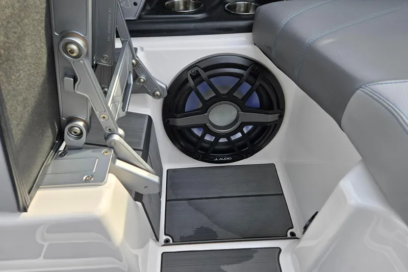 Slide: The Image of 2023 Supra SL 450 interior with JL Audio speaker and sleek seating. - 27