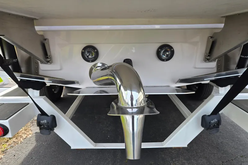 Slide: The Image of 2023 Supra SL 450 boat trailer with polished metal exhaust and dual lights. - 6