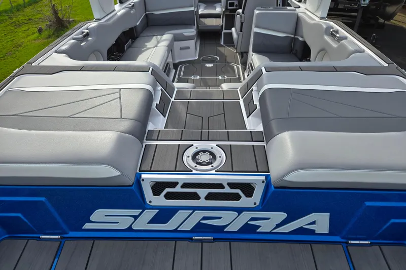 Slide: The Image of 2023 Supra SL 450 boat interior with sleek seating and modern design. - 8