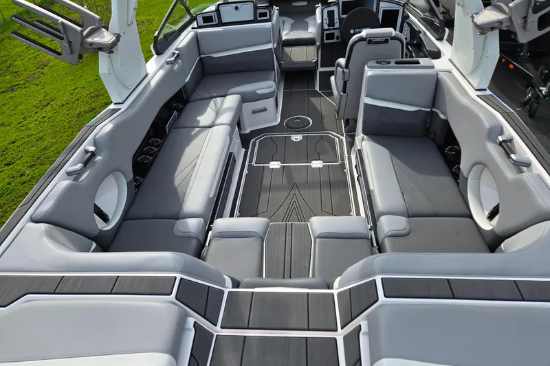 Slide: The Image of Luxurious interior of 2023 Supra SL 450 boat with sleek gray seating and modern design. - 9