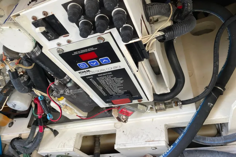 Slide: The Image of Engine compartment of 2006 Sea Ray Sundancer 260 with Kohler digital control panel. - 3