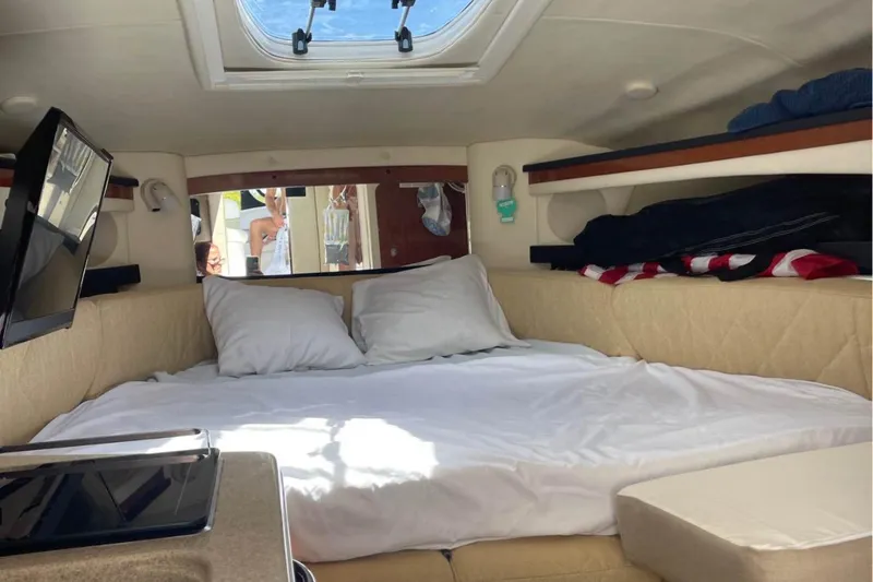 Slide: The Image of Interior cabin of 2006 Sea Ray Sundancer 260 with bed and skylight. - 8