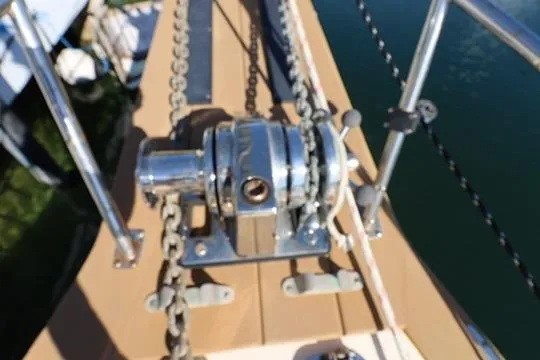 Slide: The Image of Anchor windlass on 1989 Island Packet 38 sailboat deck. - 25