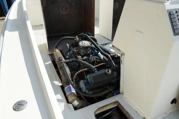 Slide: The Image of 1978 Bertram 31 Sportfisher engine compartment with visible engine components. - 5