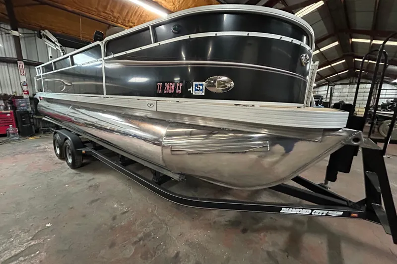 Slide: The Image of 2014 Veranda Fishing V2075-F2 pontoon boat on trailer, parked outdoors. - 1