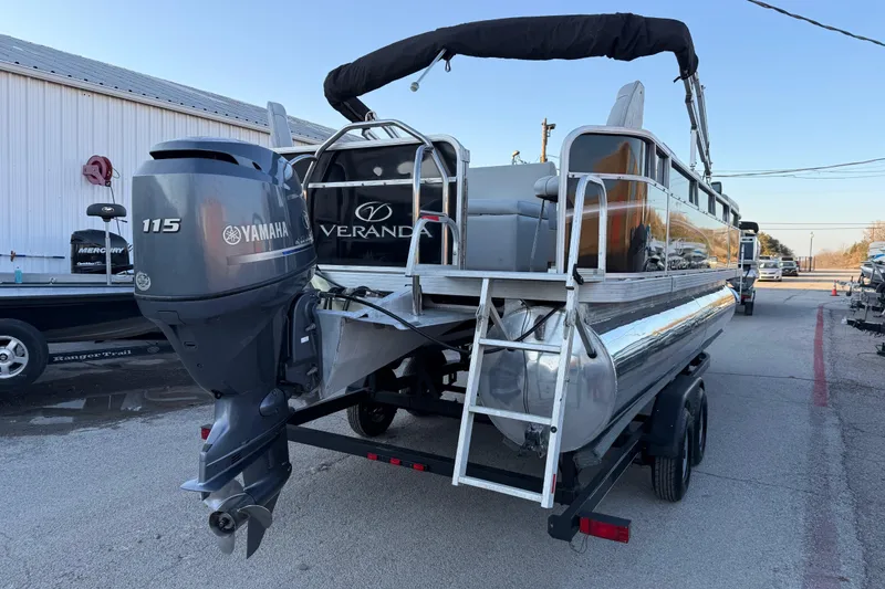 Slide: The Image of 2014 Veranda Fishing V2075-F2 pontoon boat with Yamaha 115 outboard motor, parked on trailer. - 16