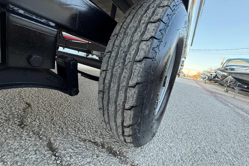 Slide: The Image of Close-up of a 2014 Veranda Fishing V2075-F2 trailer tire on a gravel surface. - 22