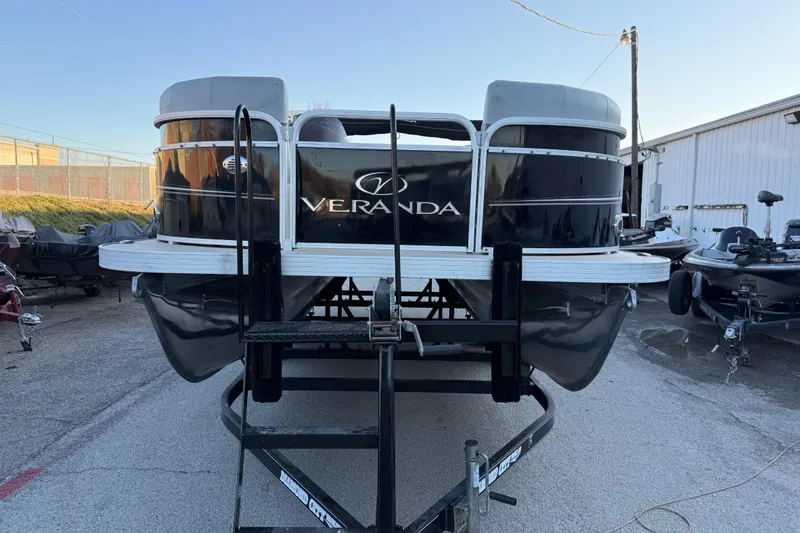 Slide: The Image of 2014 Veranda Fishing V2075-F2 pontoon boat on trailer, parked outdoors. - 25