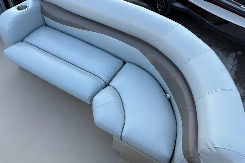 Slide: The Image of 2014 Veranda Fishing V2075-F2 boat seating with light blue upholstery and cup holder. - 26