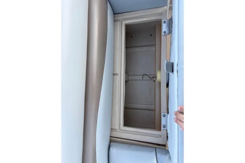 Slide: The Image of Open storage compartment on 2014 Veranda Fishing V2075-F2 boat, featuring beige interior. - 29