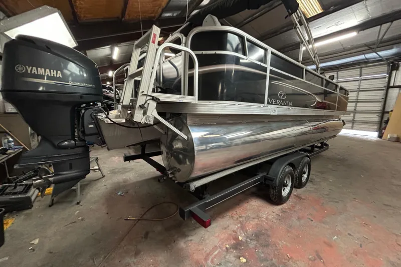 Slide: The Image of 2014 Veranda Fishing V2075-F2 pontoon boat on trailer, parked outdoors. - 3
