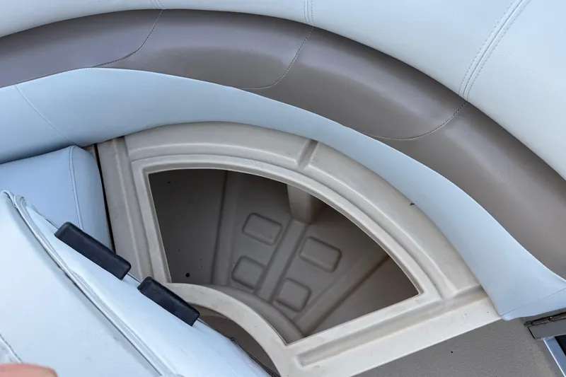 Slide: The Image of 2014 Veranda Fishing V2075-F2 boat seat storage compartment, featuring light blue and beige upholstery. - 30