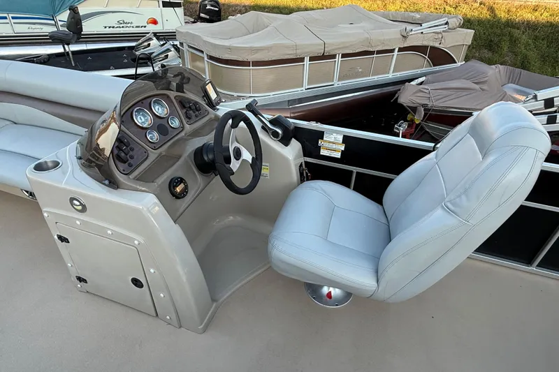 Slide: The Image of 2014 Veranda Fishing V2075-F2 boat cockpit with steering wheel and captain's chair. - 33