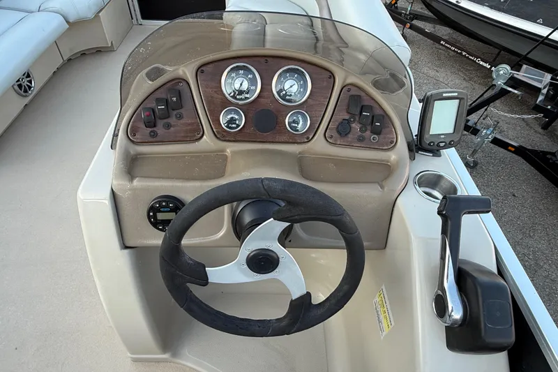 Slide: The Image of 2014 Veranda Fishing V2075-F2 boat dashboard with steering wheel and control panel. - 34