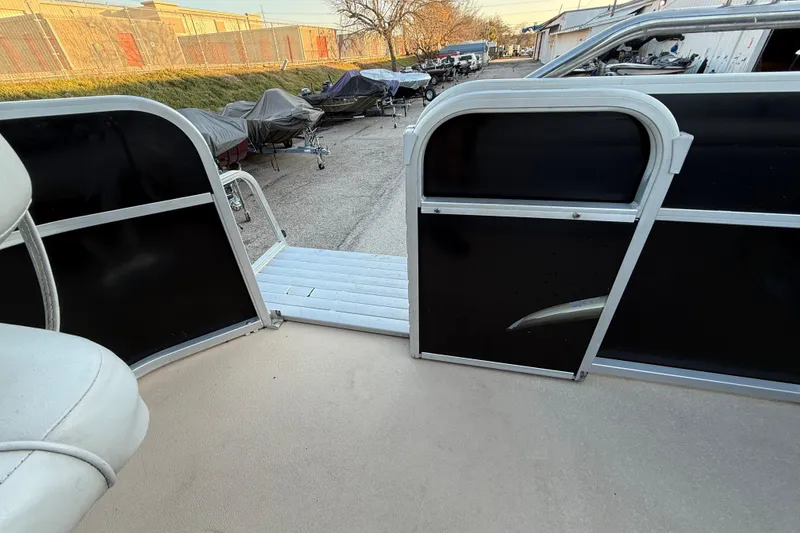 Slide: The Image of 2014 Veranda Fishing V2075-F2 boat interior with open gate and dock view. - 47