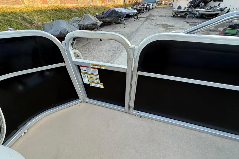 Slide: The Image of 2014 Veranda Fishing V2075-F2 boat interior with safety warnings and docked boats in background. - 48