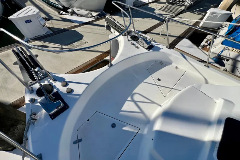 Slide: The Image of 1998 Baha Cruisers 340 CAT boat deck with anchor and storage compartments. - 16