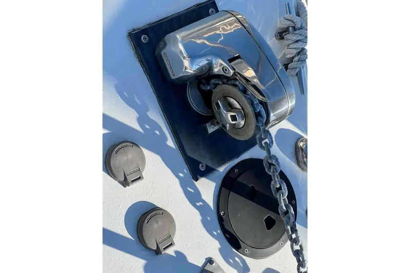 Slide: The Image of Anchor windlass on 1998 Baha Cruisers 340 CAT boat deck with chain and rope. - 22