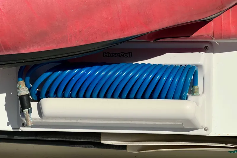 Slide: The Image of Coiled blue hose on 1998 Baha Cruisers 340 CAT boat. - 26