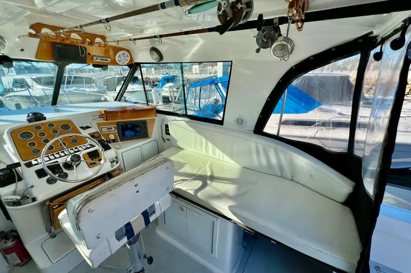 Slide: The Image of 1998 Baha Cruisers 340 CAT boat interior with helm, seating, and navigation equipment. - 28