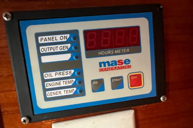 Slide: The Image of Control panel of a 1998 Baha Cruisers 340 CAT with Mase generator display. - 45