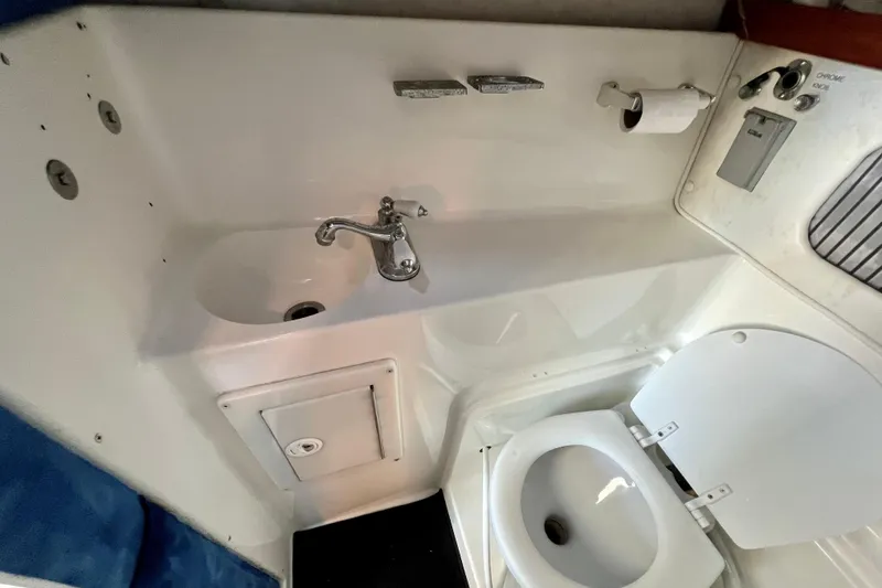 Slide: The Image of 1998 Baha Cruisers 340 CAT boat bathroom with sink and toilet. - 53