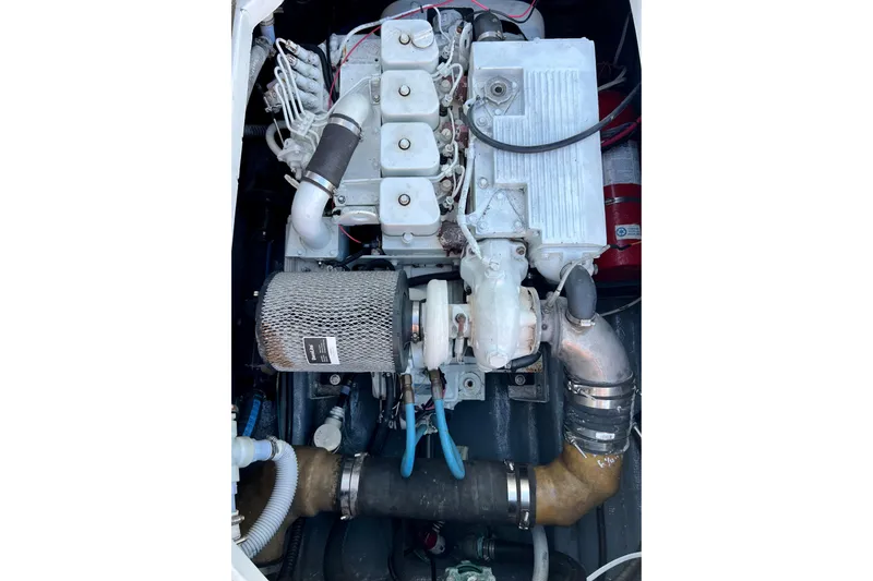 Slide: The Image of Engine of a 1998 Baha Cruisers 340 CAT boat, showcasing mechanical components. - 55