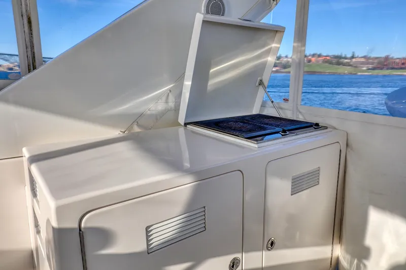 Slide: The Image of Outdoor grill on 2004 West Bay SonShip 72 Motoryacht, with ocean view in background. - 10