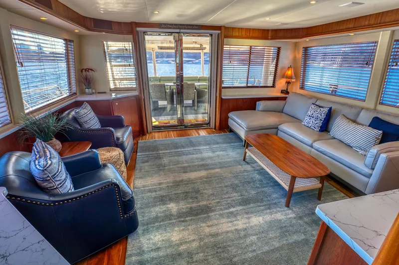 Slide: The Image of Luxurious interior of 2004 West Bay SonShip 72 Motoryacht with elegant seating and decor. - 11