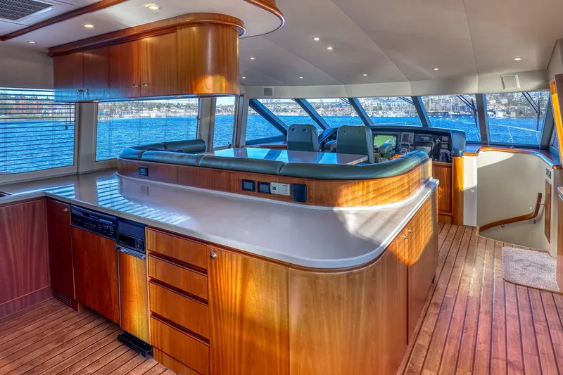 Slide: The Image of Luxurious interior of 2004 West Bay SonShip 72 Motoryacht with wood finishes and panoramic windows. - 14