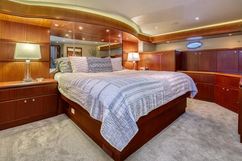 Slide: The Image of Luxurious bedroom interior of 2004 West Bay SonShip 72 Motoryacht with elegant wood finishes. - 18