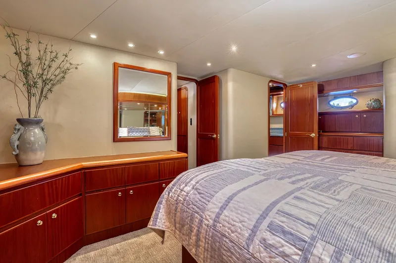 Slide: The Image of Luxurious 2004 West Bay SonShip 72 Motoryacht bedroom with elegant wood cabinetry and decor. - 19