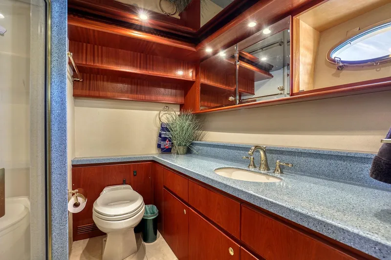 Slide: The Image of Luxurious bathroom in 2004 West Bay SonShip 72 Motoryacht with elegant wood cabinetry. - 20