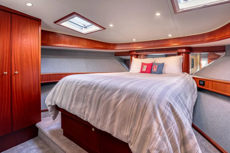 Slide: The Image of Luxurious bedroom interior of 2004 West Bay SonShip 72 Motoryacht with elegant wood finishes. - 21